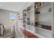 Home library with built-in shelves and hardwood flooring at 3170 Double Bridges Rd, Rutledge, GA 30663