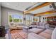 Spacious living room with farmhouse feel, exposed beams, and serene views at 3170 Double Bridges Rd, Rutledge, GA 30663