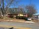Red brick ranch home with landscaping and driveway at 771 San Fernando Dr, Smyrna, GA 30080