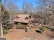 Rustic home nestled in a wooded area, seen from above at 2535 Rock Springs Rd, Buford, GA 30519