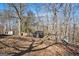 Wooded backyard with sheds and playset at 2535 Rock Springs Rd, Buford, GA 30519
