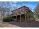 Two-story home with large deck and hillside location at 2535 Rock Springs Rd, Buford, GA 30519