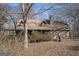 A rustic home with a stone and log exterior at 2535 Rock Springs Rd, Buford, GA 30519