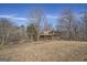 Rustic home with stone and log exterior, driveway visible at 2535 Rock Springs Rd, Buford, GA 30519