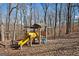 Wooden playground with slide and climbing structure at 2535 Rock Springs Rd, Buford, GA 30519