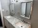 Bathroom featuring tile flooring, a double sink vanity with marble countertops and gray walls at 1771 Ware Ave, East Point, GA 30344