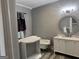 Bathroom view featuring a clawfoot tub, decorative mirror, and vanity with marble countertop at 1771 Ware Ave, East Point, GA 30344