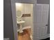 Half bathroom with pedestal sink and mosaic tile backsplash at 1771 Ware Ave, East Point, GA 30344