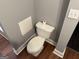 A bathroom featuring a toilet, and fresh roll of toilet paper at 1771 Ware Ave, East Point, GA 30344