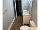 Bathroom featuring tile flooring, a white toilet, double sinks, and gray walls at 1771 Ware Ave, East Point, GA 30344