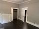 Spacious bedroom featuring an decorative fireplace and dark wood flooring at 1771 Ware Ave, East Point, GA 30344