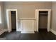 Bedroom with hardwood floors, closets, and a decorative fireplace at 1771 Ware Ave, East Point, GA 30344
