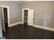 A bedroom featuring dark floors and doorways to other rooms at 1771 Ware Ave, East Point, GA 30344