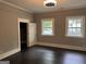 Bedroom with a ceiling fan, two windows, and a closet at 1771 Ware Ave, East Point, GA 30344