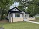 Charming grey house with black trim and inviting front porch at 1771 Ware Ave, East Point, GA 30344