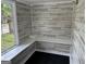 Bright interior view, shiplap walls, built-in shelf and black floor at 1771 Ware Ave, East Point, GA 30344