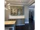 Green kitchen cabinets, white subway tile backsplash, and black hardwood floors at 1771 Ware Ave, East Point, GA 30344