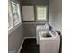 Modern laundry room with bright windows, cabinets and updated washer and dryer at 1771 Ware Ave, East Point, GA 30344