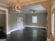 Spacious living room featuring hardwood floors, fireplace, and decorative lighting at 1771 Ware Ave, East Point, GA 30344