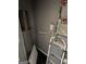 A gray storage area features a hot water heater, utility box and ladders at 1771 Ware Ave, East Point, GA 30344