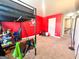 Bright bedroom with red walls and a loft bed at 11958 Quail Dr, Hampton, GA 30228