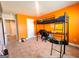 bedroom with orange walls and a loft bed at 11958 Quail Dr, Hampton, GA 30228