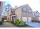 Two-story brick home with two-car garage and landscaping at 11958 Quail Dr, Hampton, GA 30228