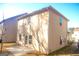 Tan brick home with a patio and backyard at 11958 Quail Dr, Hampton, GA 30228