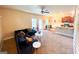 Open living room with sectional sofa, kitchen island, and dining area at 11958 Quail Dr, Hampton, GA 30228