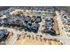 Aerial view of the community, showcasing homes and a pond at 200 Jamestowne Pass, Peachtree City, GA 30269