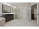 Modern bathroom with walk-in shower and double vanity at 200 Jamestowne Pass, Peachtree City, GA 30269