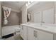 Clean bathroom with double vanity and bathtub shower combo at 200 Jamestowne Pass, Peachtree City, GA 30269