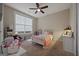 Bright bedroom with a twin bed and window seat at 200 Jamestowne Pass, Peachtree City, GA 30269
