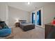 Cozy bedroom with twin bed and access to a balcony at 200 Jamestowne Pass, Peachtree City, GA 30269