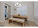 Bright dining area with farmhouse table and bench seating at 200 Jamestowne Pass, Peachtree City, GA 30269