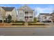 Two-story home with gray siding, red door, and front porch at 200 Jamestowne Pass, Peachtree City, GA 30269