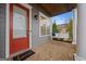 Front porch with a porch swing and brick flooring at 200 Jamestowne Pass, Peachtree City, GA 30269