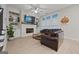 Gathering room with a stone fireplace and leather sofa at 200 Jamestowne Pass, Peachtree City, GA 30269
