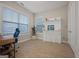 Bright home office with built-in shelving and hardwood floors at 200 Jamestowne Pass, Peachtree City, GA 30269