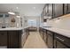 Modern kitchen with stainless steel appliances and white quartz countertops at 200 Jamestowne Pass, Peachtree City, GA 30269