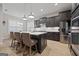 Modern kitchen with island, stainless steel appliances, and white quartz countertops at 200 Jamestowne Pass, Peachtree City, GA 30269