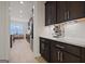 Modern kitchen with coffee bar and white quartz countertops at 200 Jamestowne Pass, Peachtree City, GA 30269
