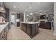 Open concept kitchen and Gathering room with large island and fireplace at 200 Jamestowne Pass, Peachtree City, GA 30269