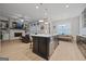 Open floor plan with kitchen island, Gathering room fireplace and built-in shelving at 200 Jamestowne Pass, Peachtree City, GA 30269