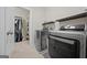 Convenient laundry room with washer, dryer, and extra storage at 200 Jamestowne Pass, Peachtree City, GA 30269
