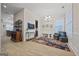 Spacious living room with hardwood floors, chandelier, and built-in shelving at 200 Jamestowne Pass, Peachtree City, GA 30269