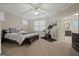 Spacious main bedroom with plush carpeting and en-suite bathroom at 200 Jamestowne Pass, Peachtree City, GA 30269