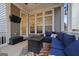 Cozy screened porch with seating and a fire pit at 200 Jamestowne Pass, Peachtree City, GA 30269