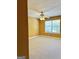 Bedroom displaying a large window, a ceiling fan with lights, and neutral carpeting at 2567 Laurel Nw Cir, Atlanta, GA 30311