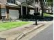 Two-story home with attached garage, manicured lawn, and mailbox at 2567 Laurel Nw Cir, Atlanta, GA 30311